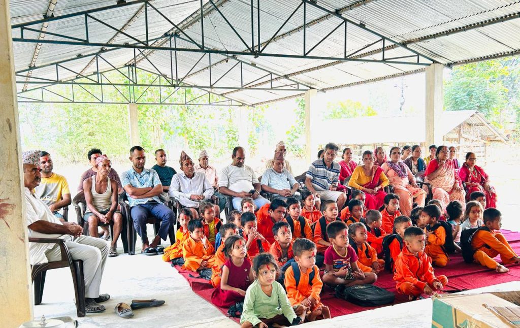 Parents and students of Narmadeshwar Aadarsha Sanskrit Bidyapheet Gurukul gathered for a school program in an open-air classroom in Nepal.